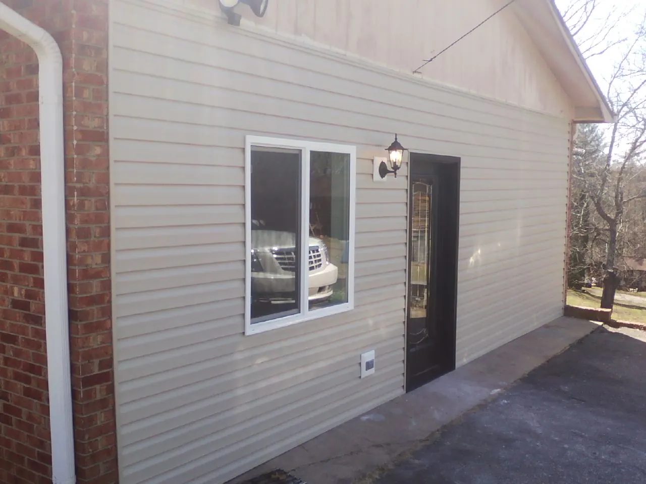 New vinyl siding and entry door on a room addition in Bellwood